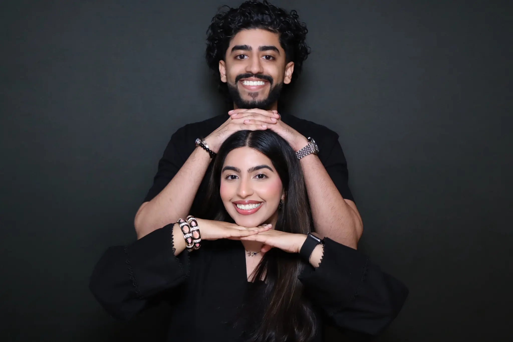 Elegantly dressed couple photographed at a private celebration