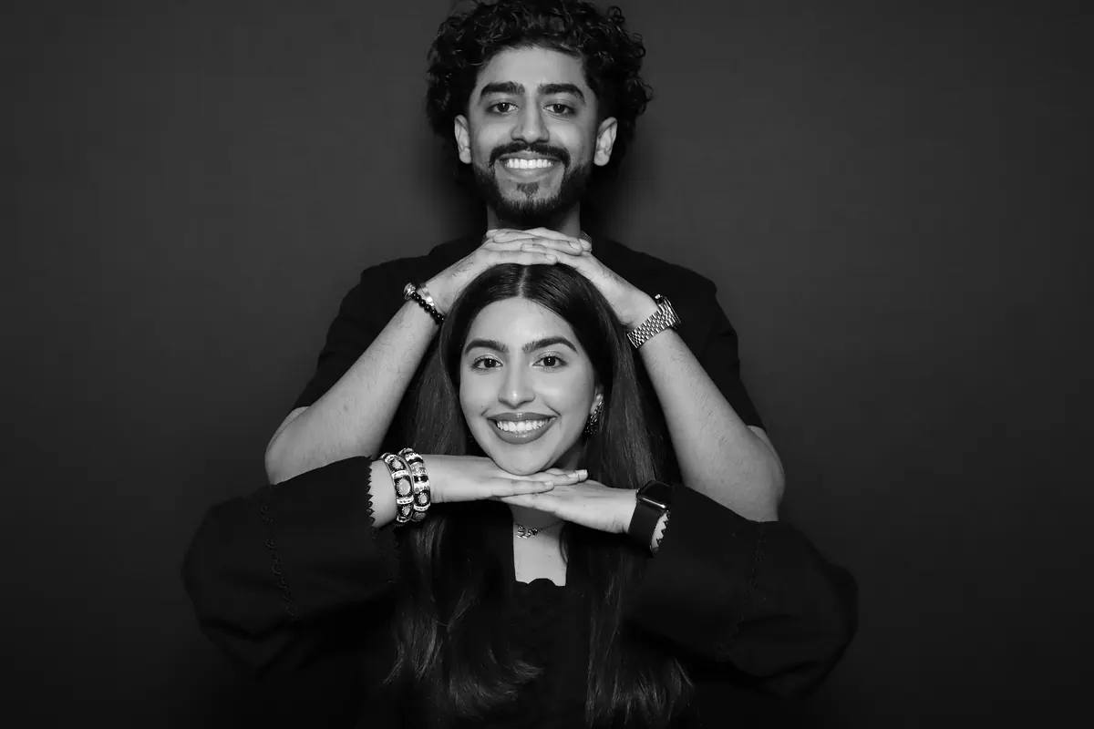 Guests posing for a black-and-white Glam portrait