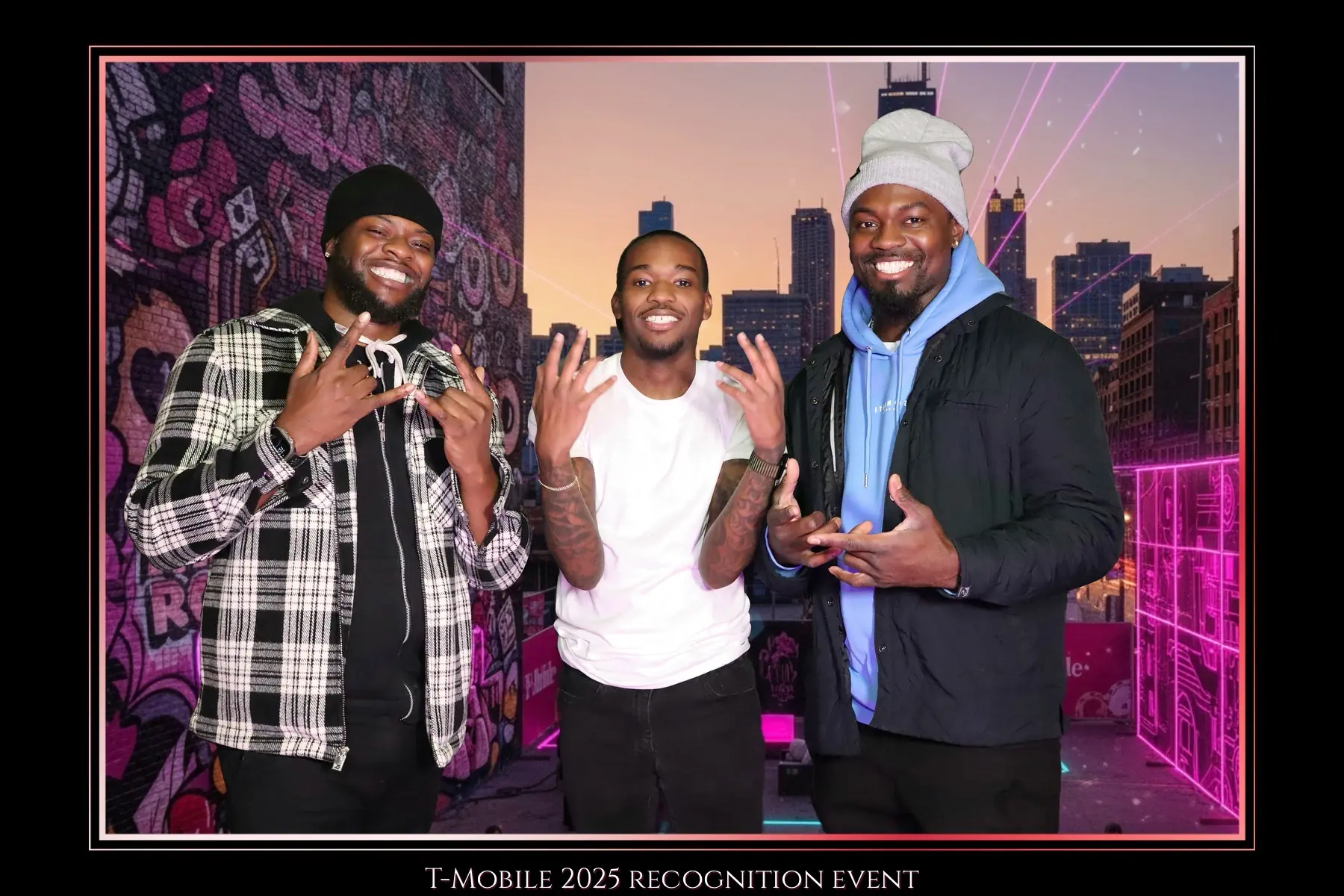 Three guests photographed against a custom Chicago event backdrop