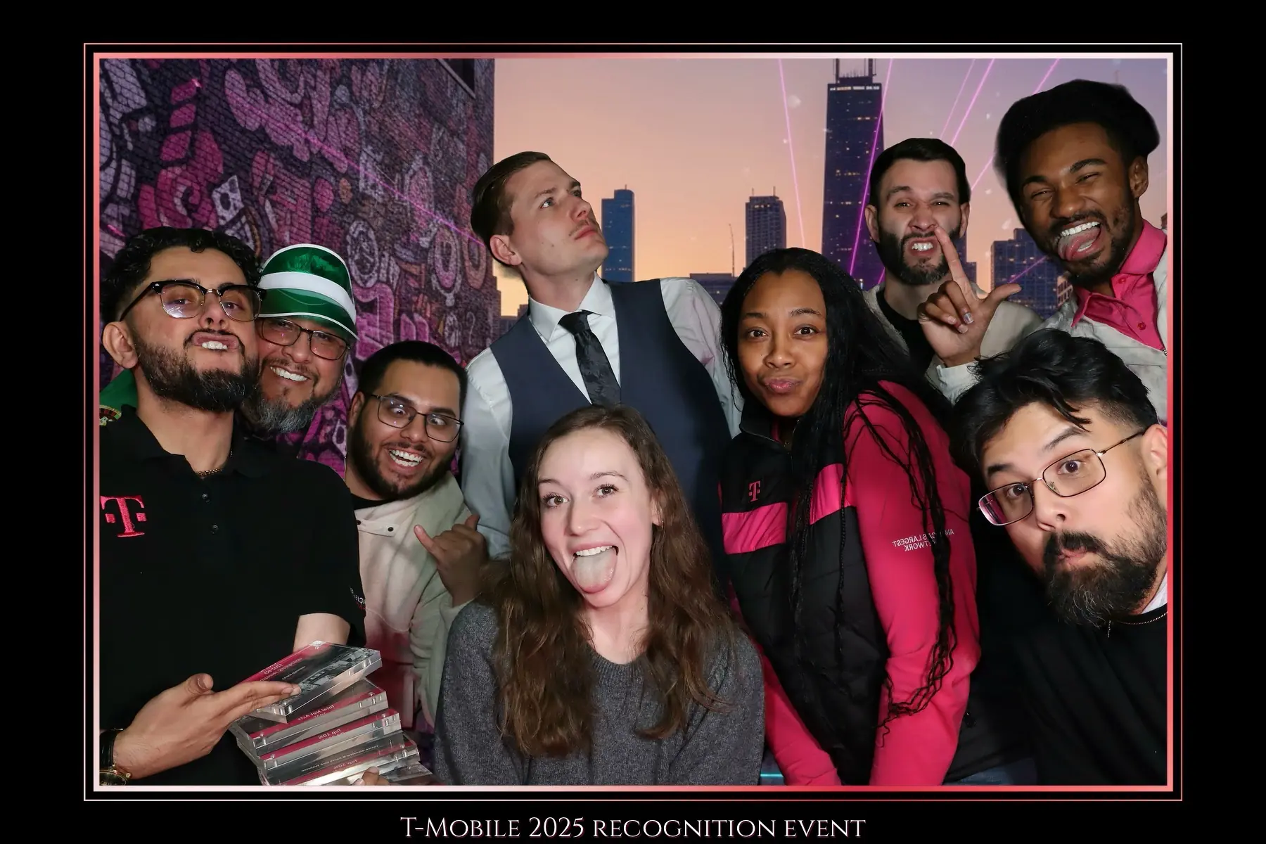 Corporate recognition-event team posing in a branded booth frame by Images & Creations