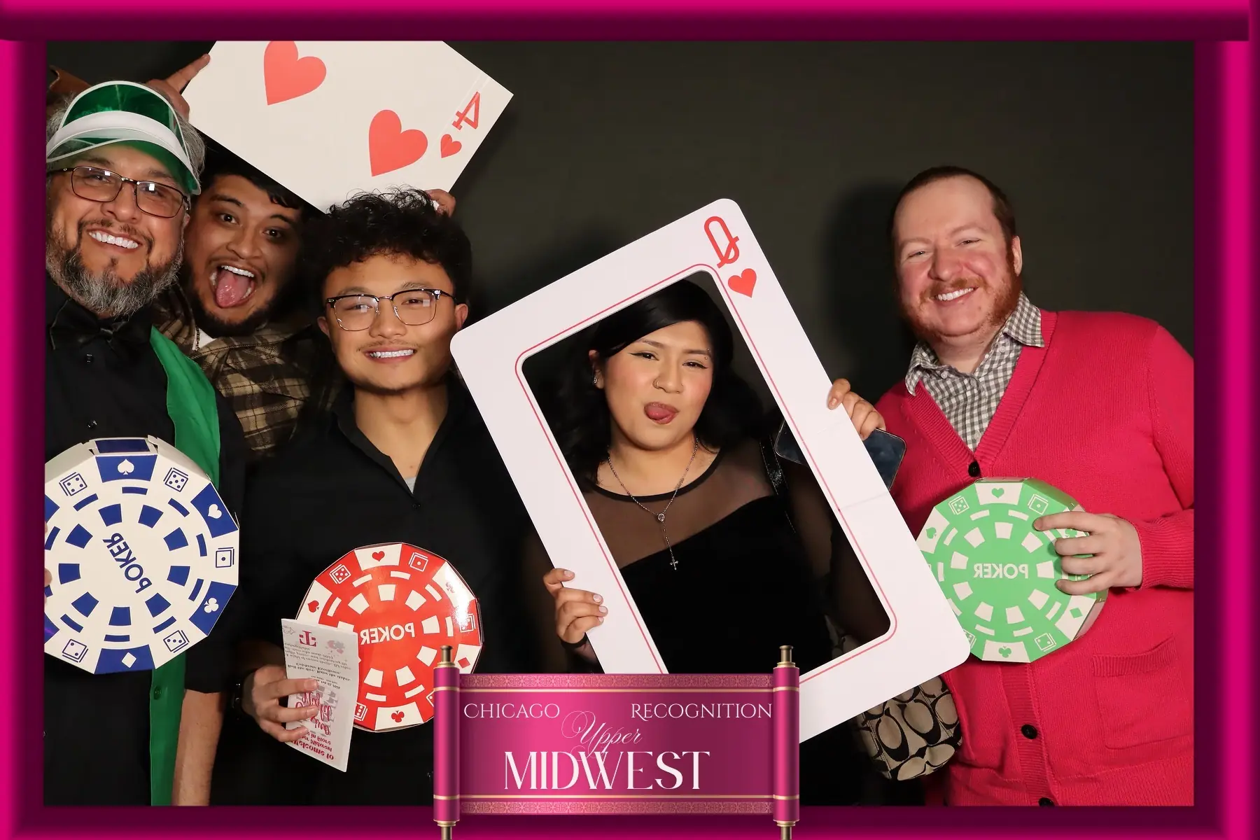 Five guests sharing a high-energy photo booth moment by Images & Creations