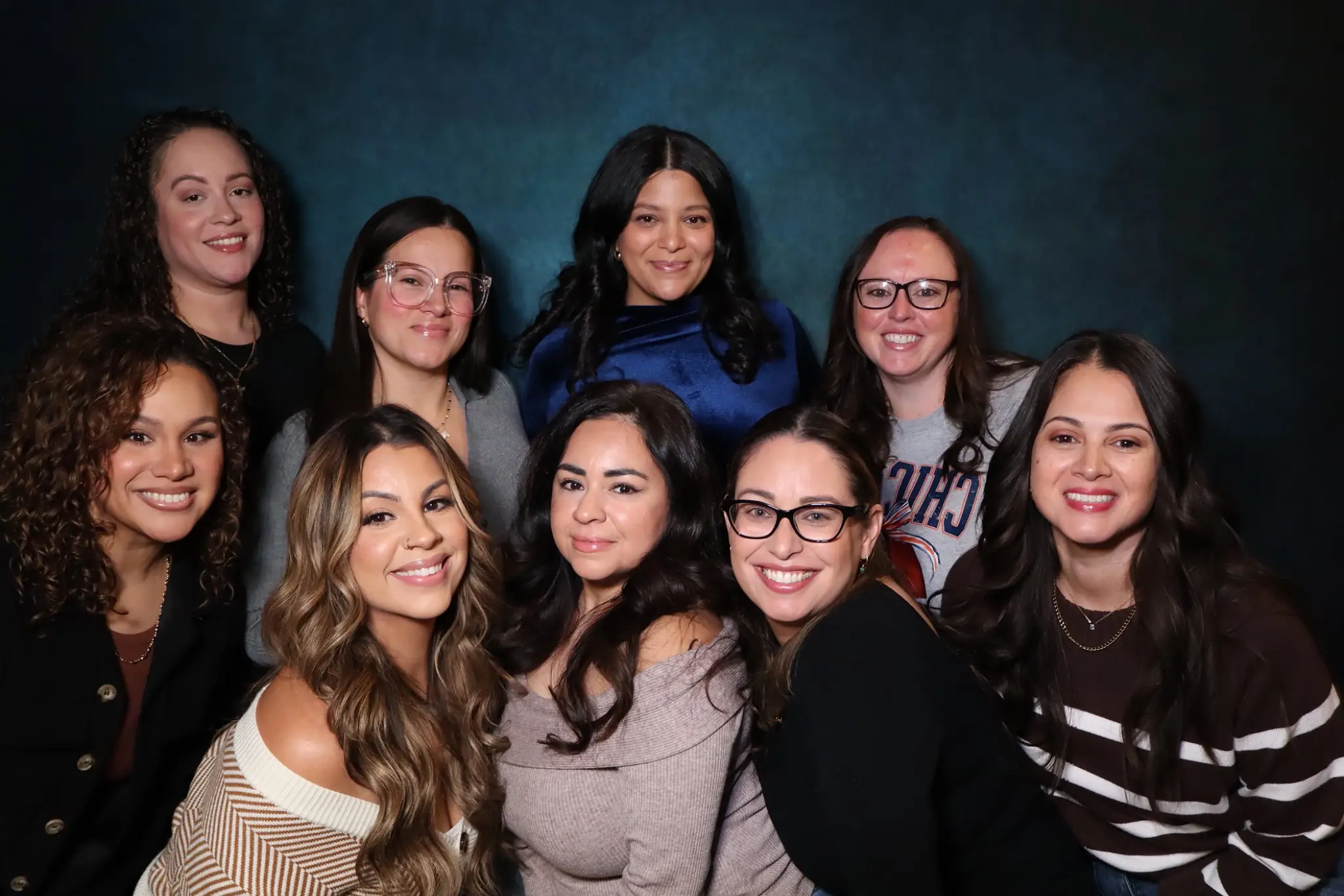 Large baby shower group portrait with joyful expressions