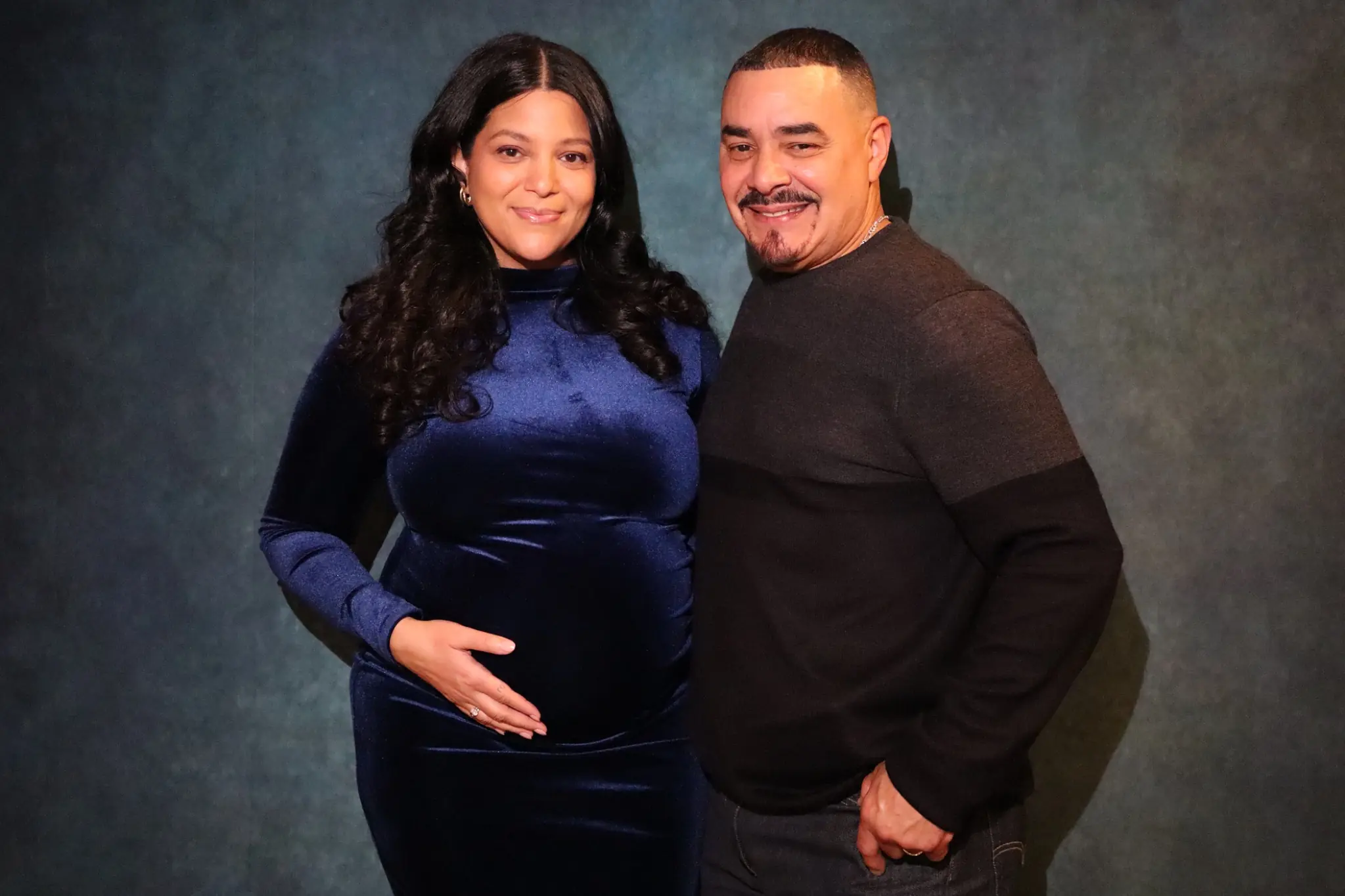 Parents-to-be photographed together at their baby shower by Images & Creations