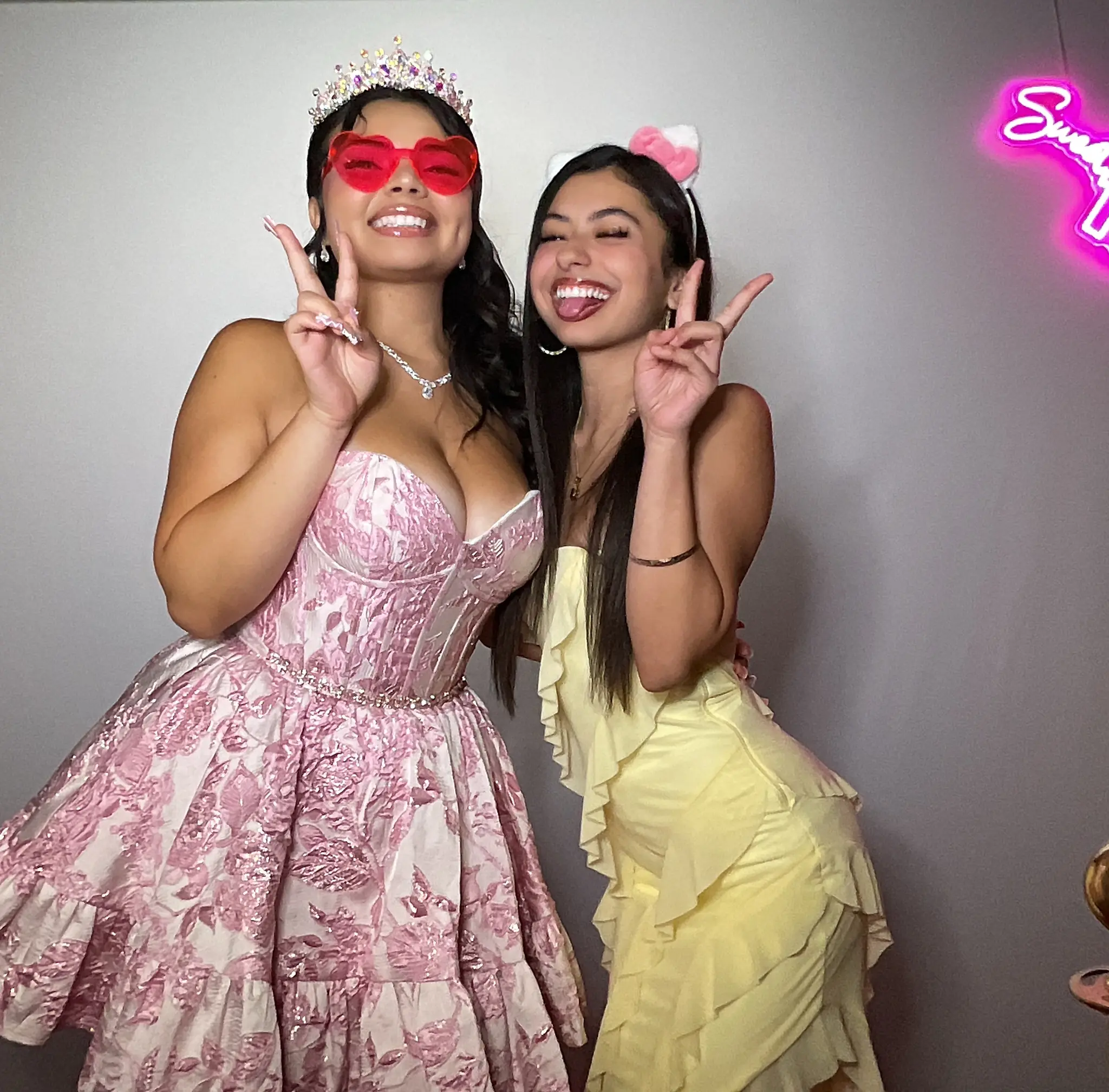 Maleah and a friend sharing a playful party pose by Images & Creations